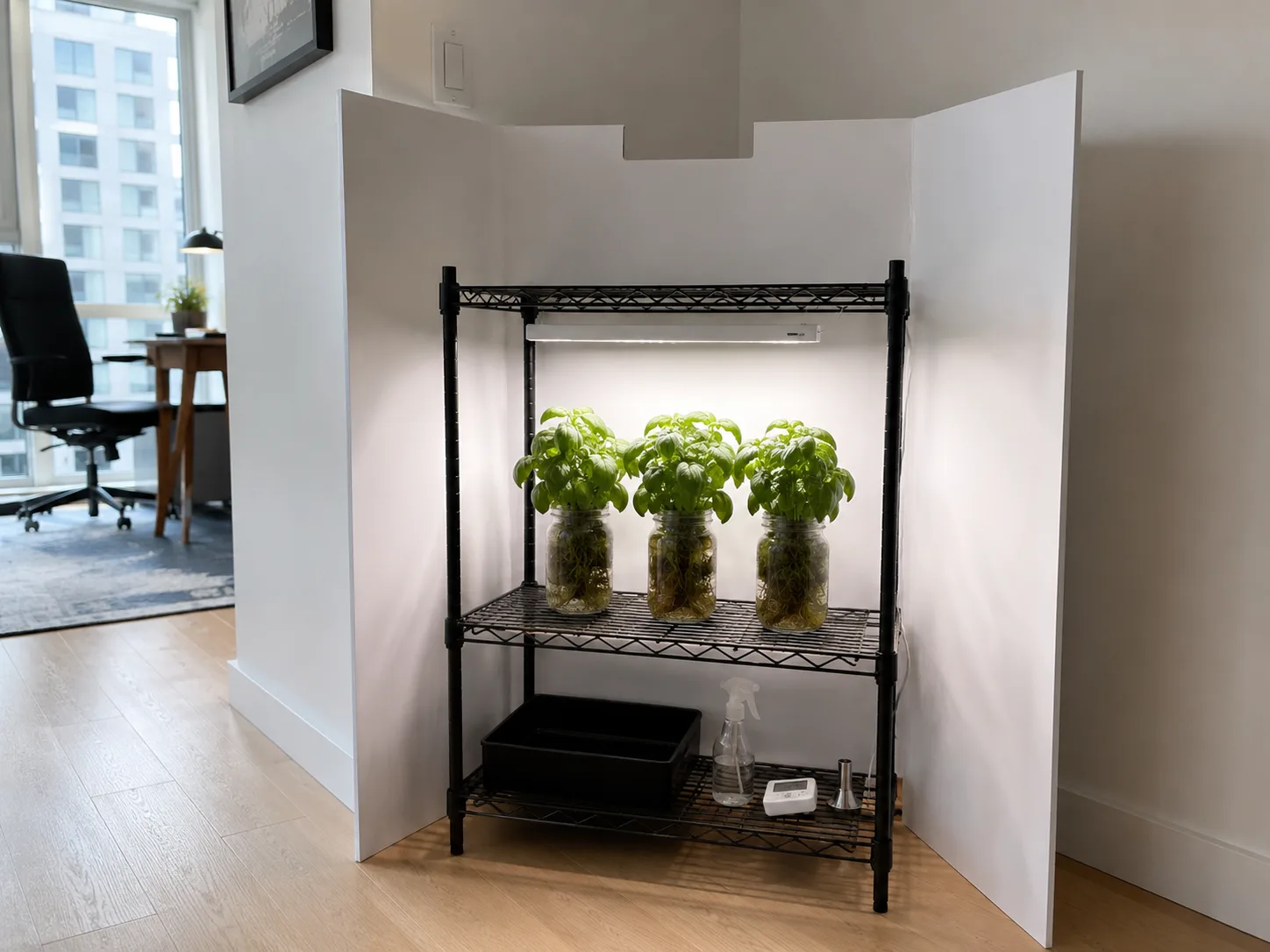 White trifold foam board screen standing around a herb shelf with a ventilation notch cut in the top edge
