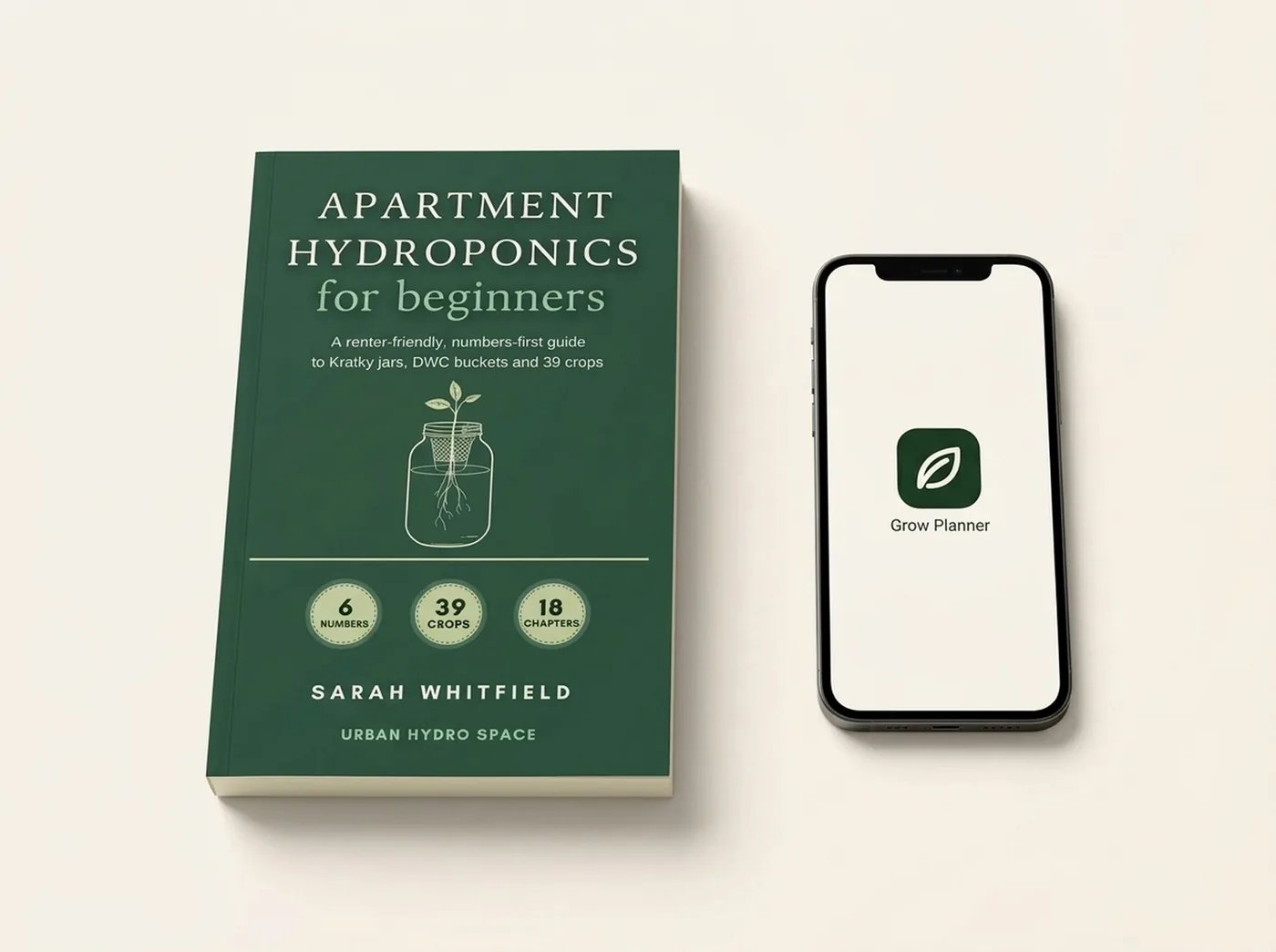 The Apartment Hydroponics for Beginners paperback lying beside a phone showing the free Grow Planner app icon